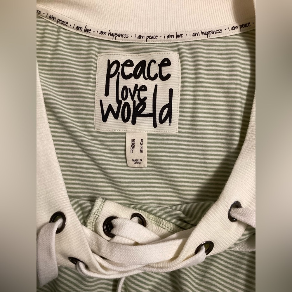 Peace Love World lace up long sleeved top